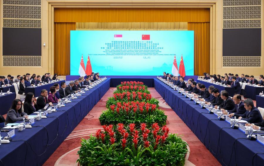 12.16丁薛祥会见新加坡副总理颜金勇并共同主持中新双边合作机制会议.jpeg